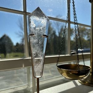 Quartz wand in gold stand